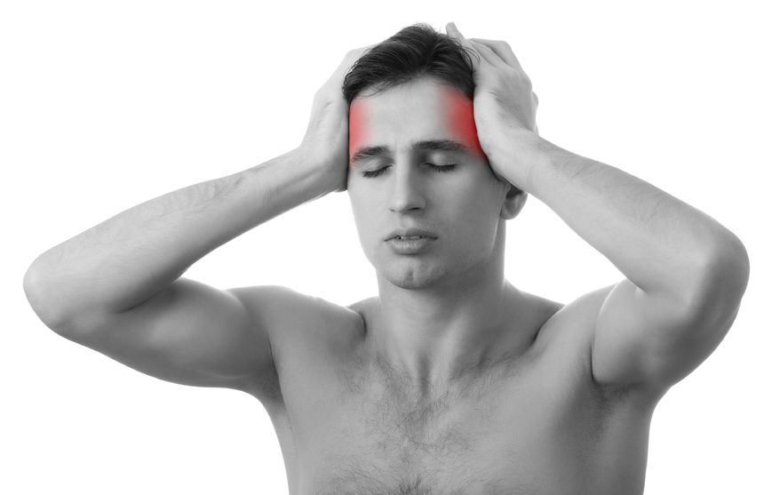 Man holding his head with marks illustrating migraine pain.